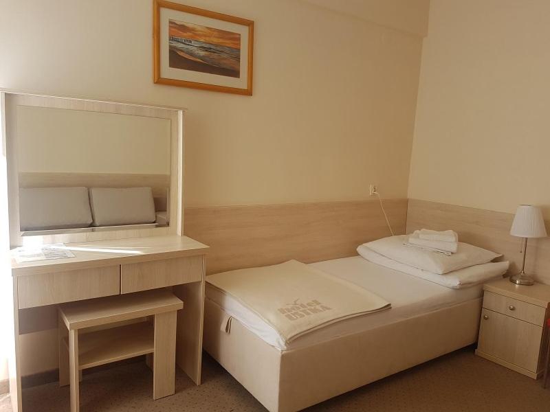 Postel nebo postele na pokoji v ubytování Hotel Ustka
