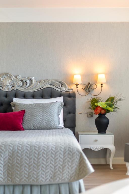 A bed or beds in a room at CVK Taksim Hotel Istanbul
