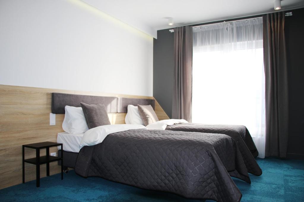Posteľ alebo postele v izbe v ubytovaní Lemon Plaza Hotel