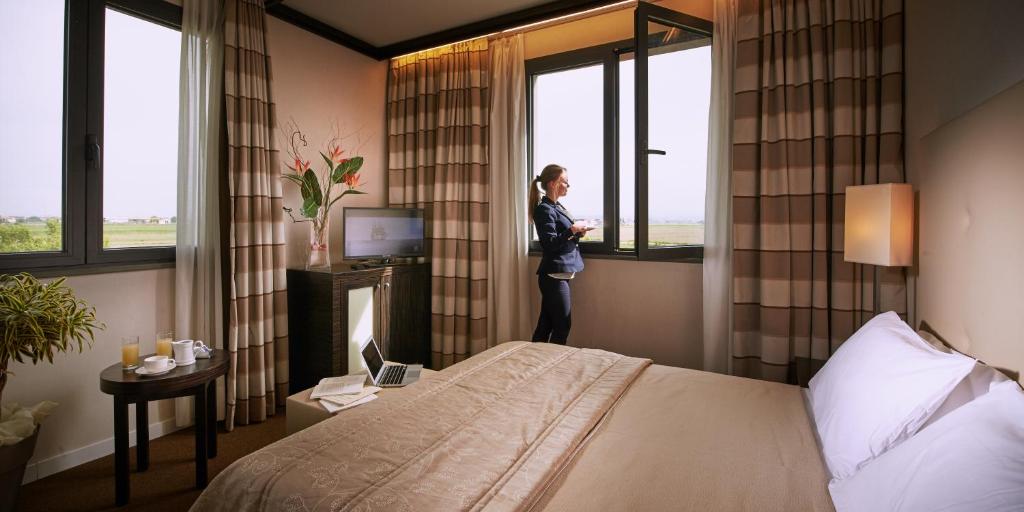 Postel nebo postele na pokoji v ubytování Hotel Pisa Valdera