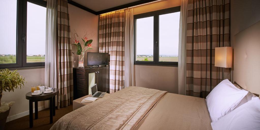Postel nebo postele na pokoji v ubytování Hotel Pisa Valdera