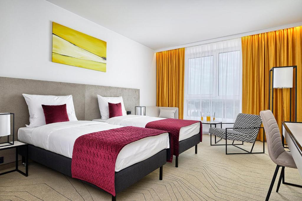 Posteľ alebo postele v izbe v ubytovaní Arche Hotel Krakowska