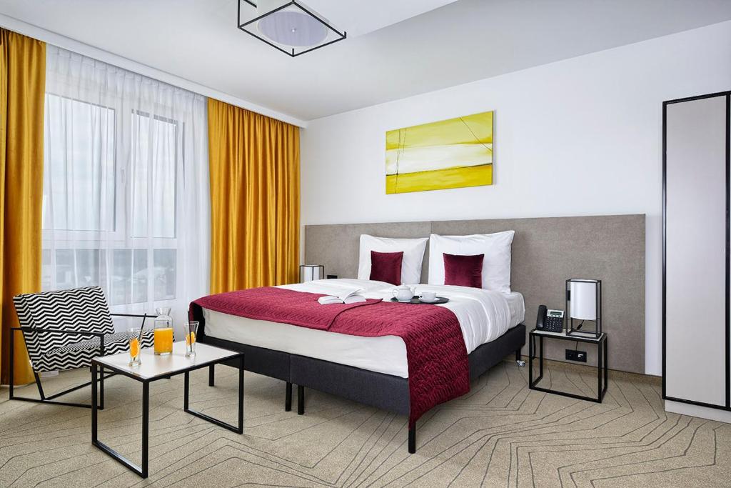 Posteľ alebo postele v izbe v ubytovaní Arche Hotel Krakowska