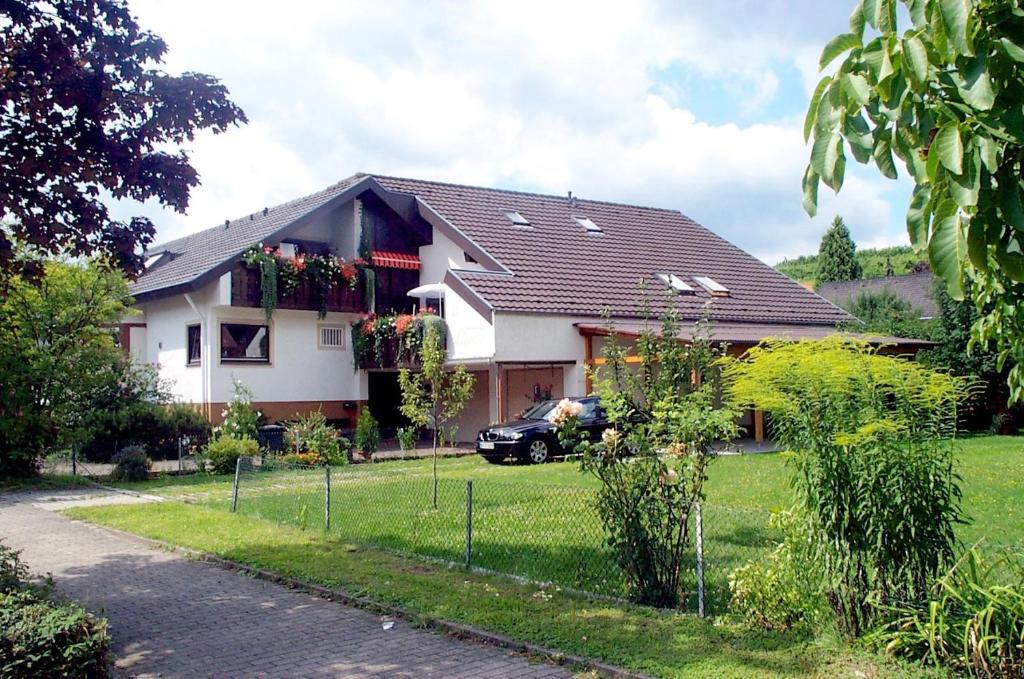 a house with a fence in front of it at Gästehaus Linde in Endingen