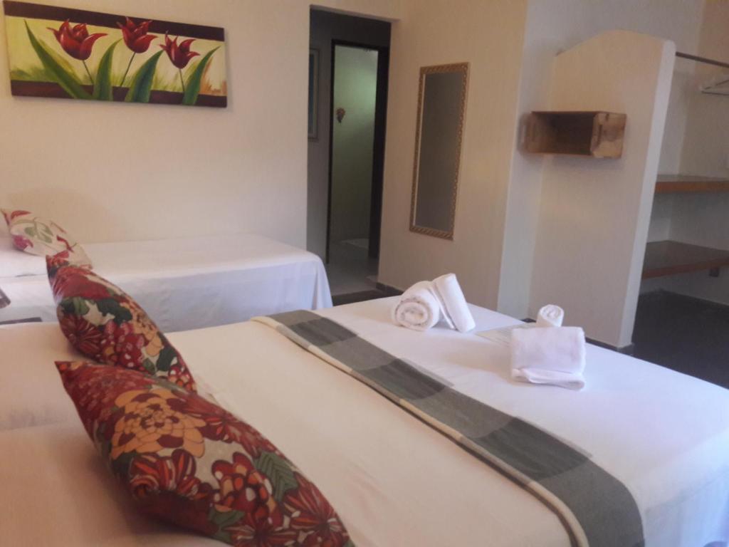 Cama ou camas em um quarto em Pousada Macunaima
