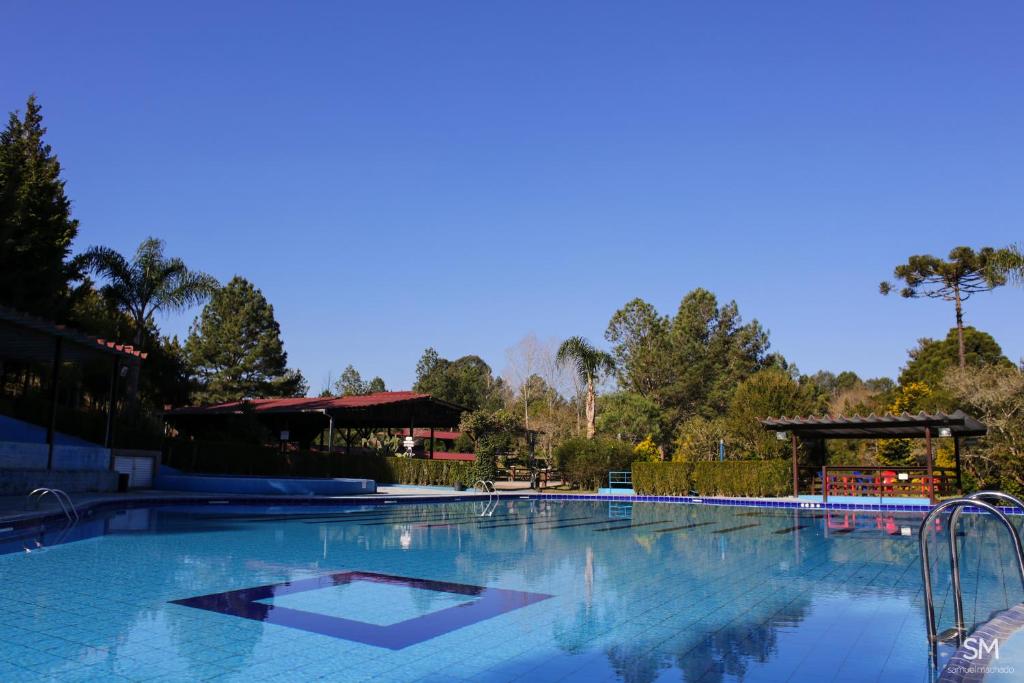 a large swimming pool with blue water at Piazito Park Hotel in Fragosos