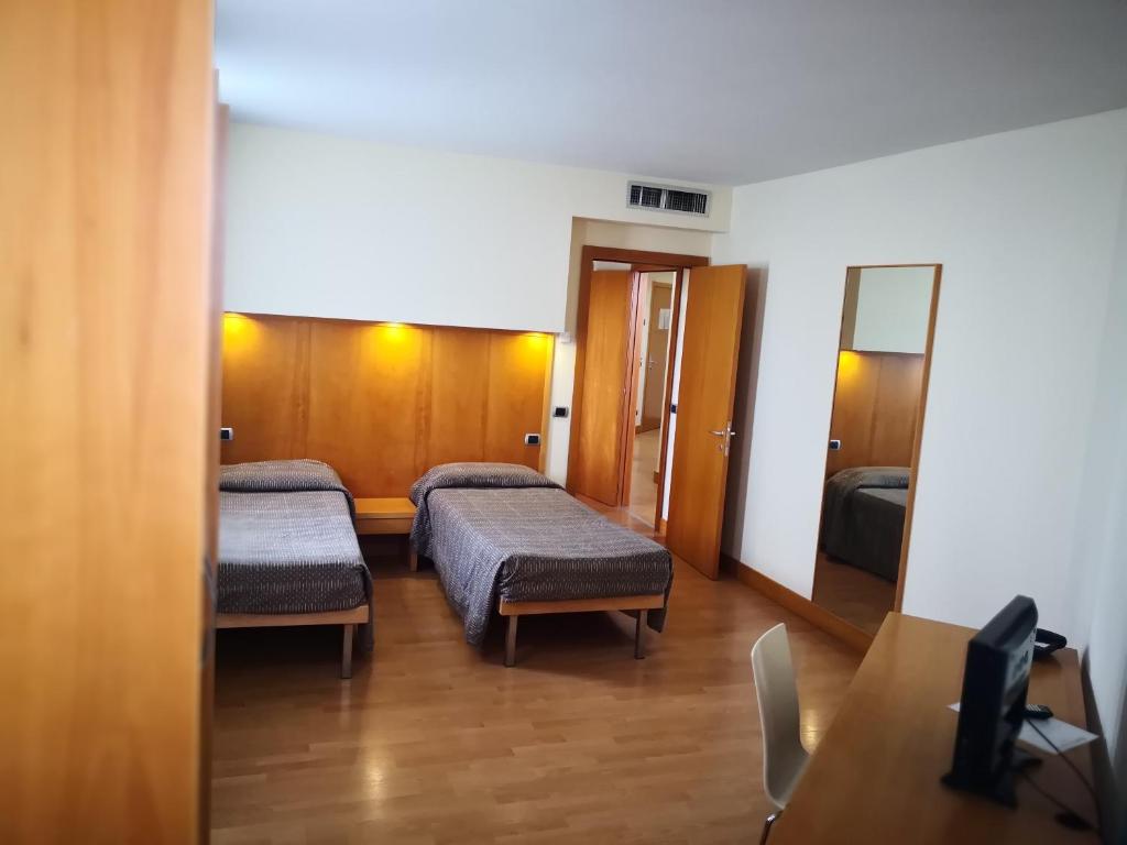 Postel nebo postele na pokoji v ubytování Hotel Ristorante Trendy