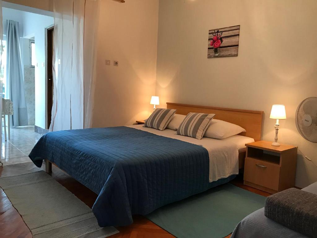 Postel nebo postele na pokoji v ubytování Apartmani Stula