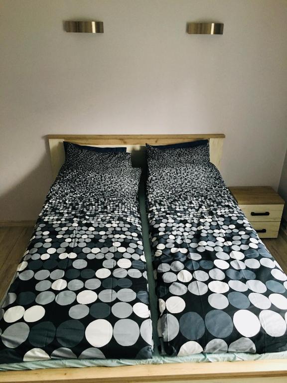 Posteľ alebo postele v izbe v ubytovaní Apartament Ala