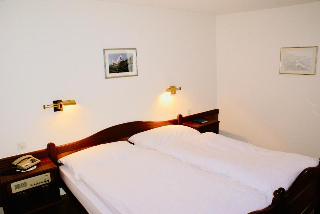 Postel nebo postele na pokoji v ubytování Hotel du Pont