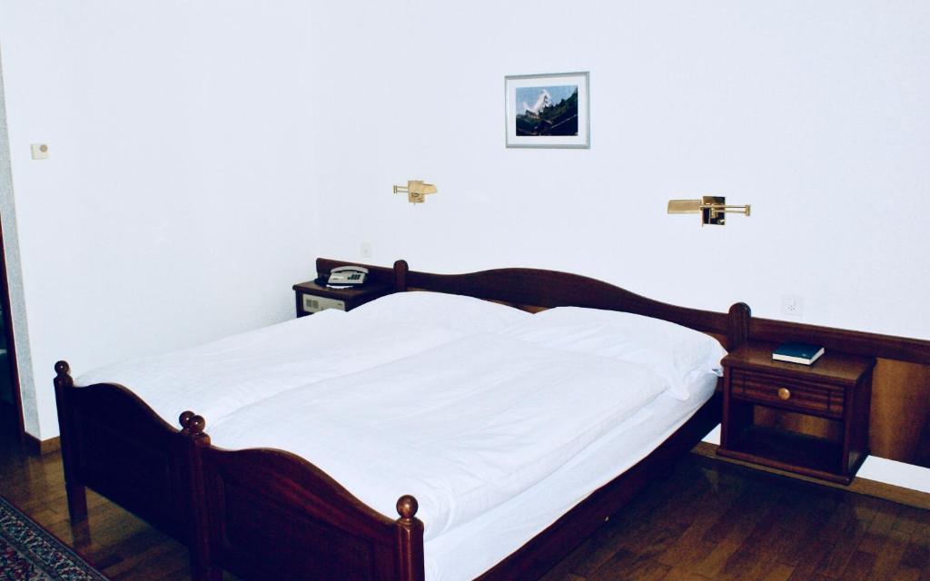 Postel nebo postele na pokoji v ubytování Hotel du Pont