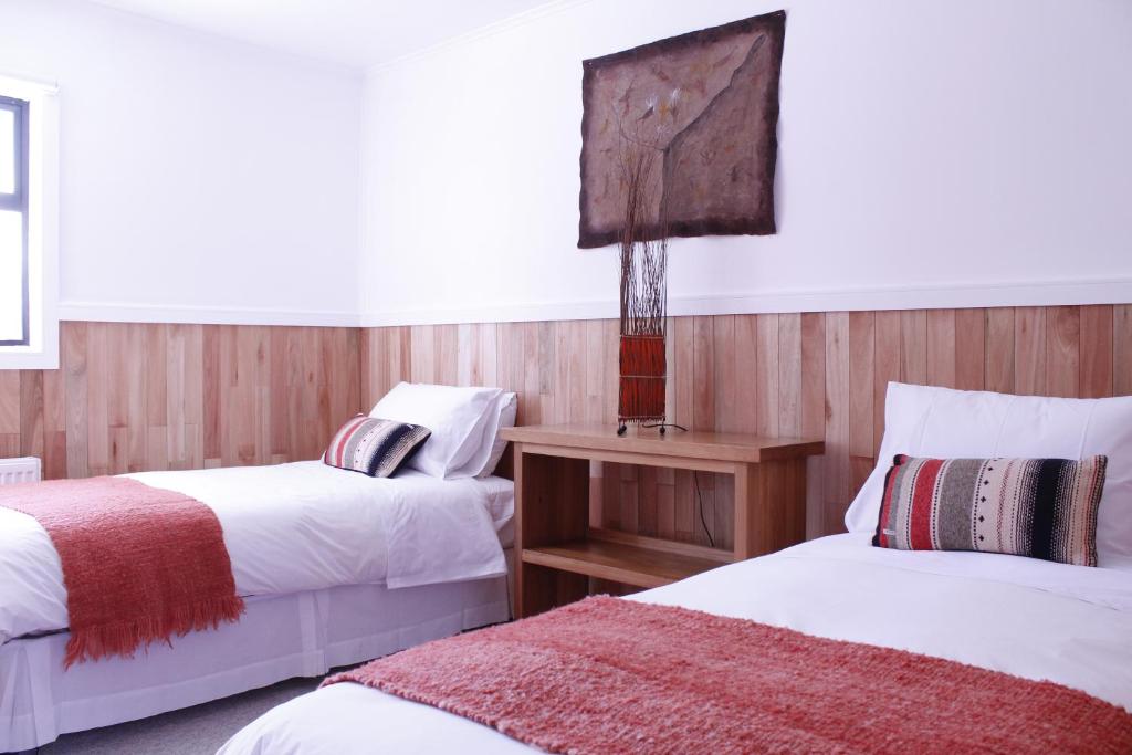 Llit o llits en una habitació de Hotel Aquaterra