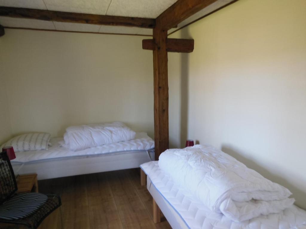 Postel nebo postele na pokoji v ubytování Nyager Apartments