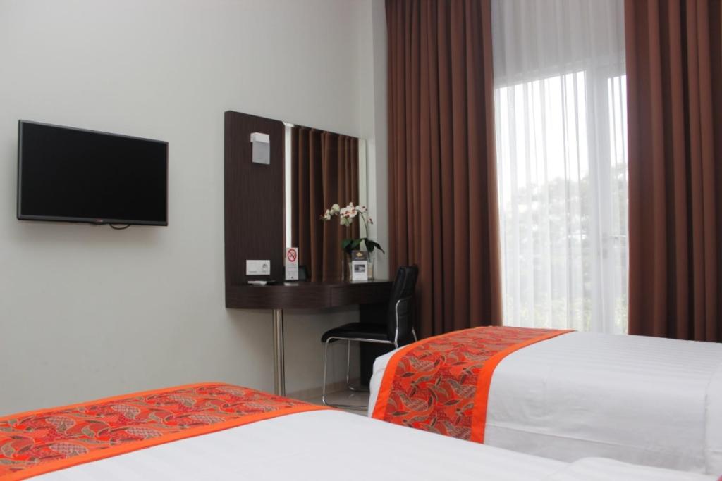 Postel nebo postele na pokoji v ubytování Moscato Hotel