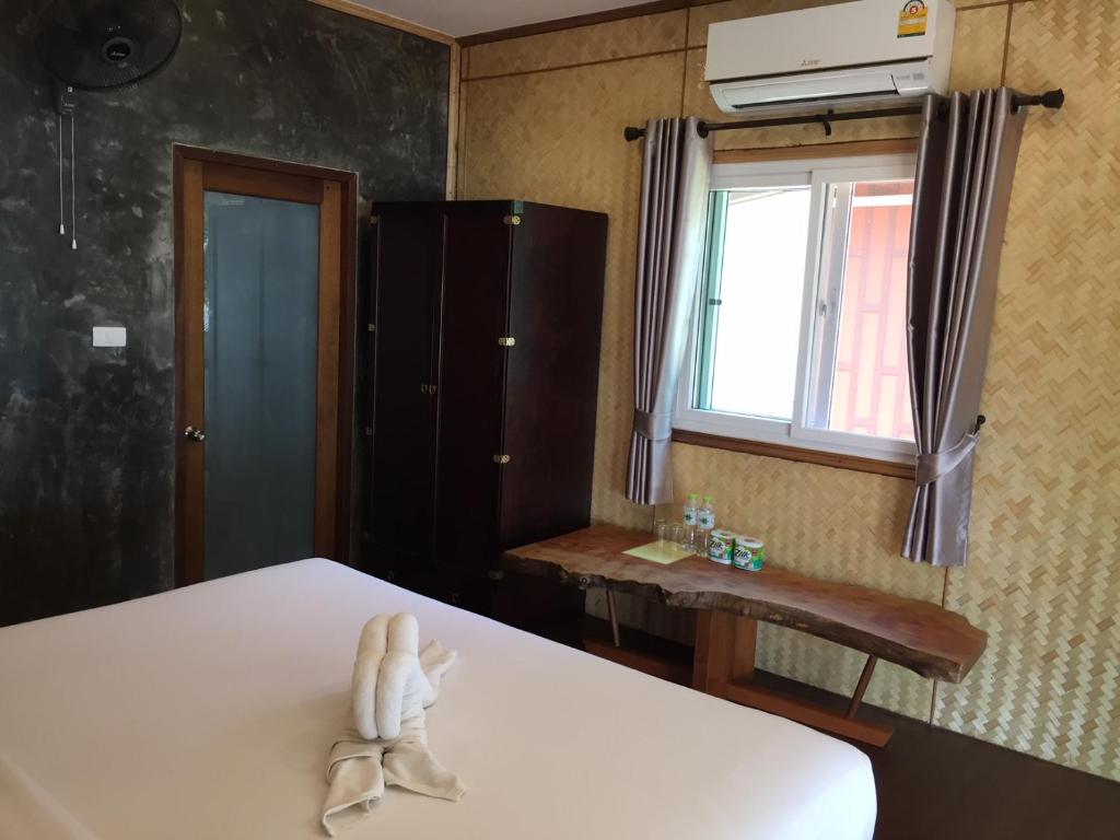 Postel nebo postele na pokoji v ubytování Bangbaobeach Resort