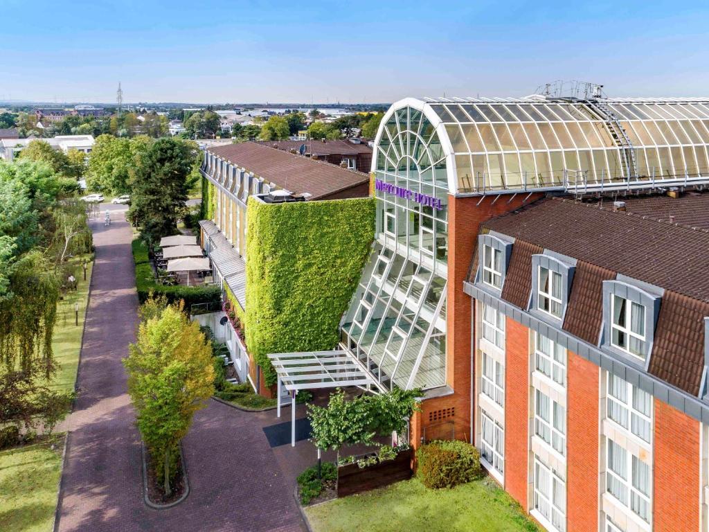 an overhead view of a building with a green wall at Mercure Düsseldorf Kaarst in Kaarst