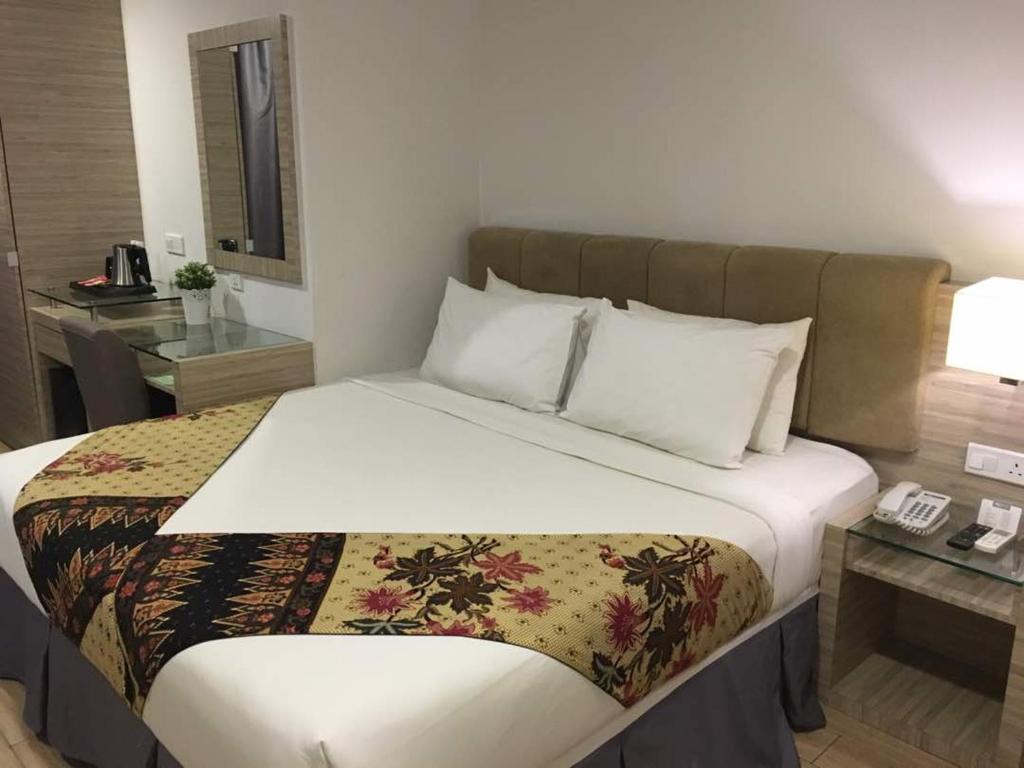 Postel nebo postele na pokoji v ubytování NU Hotel @ KL Sentral