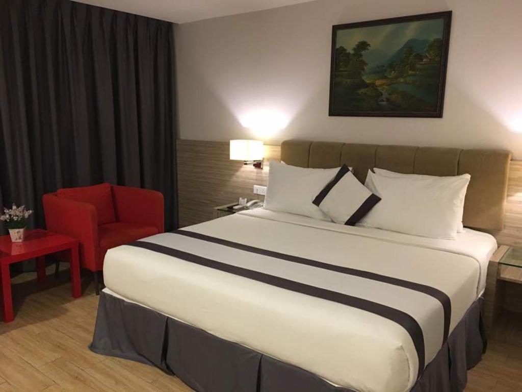 Postel nebo postele na pokoji v ubytování NU Hotel @ KL Sentral