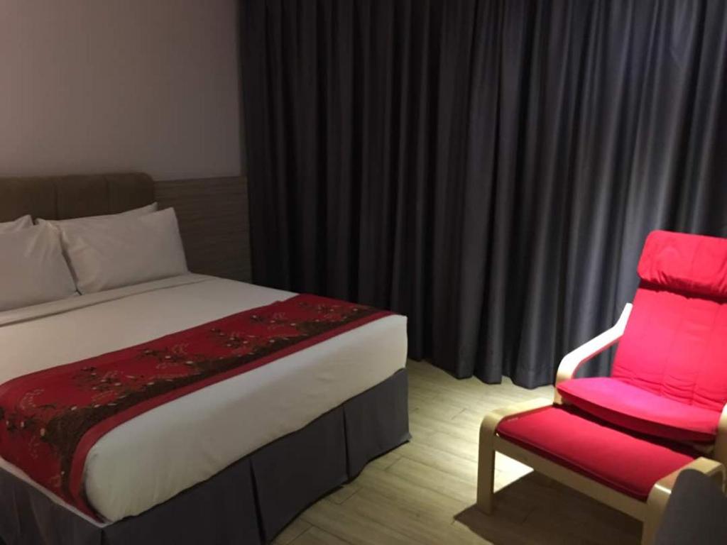 Postel nebo postele na pokoji v ubytování NU Hotel @ KL Sentral