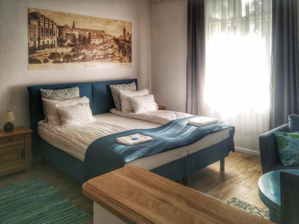Posteľ alebo postele v izbe v ubytovaní M37 Apartman