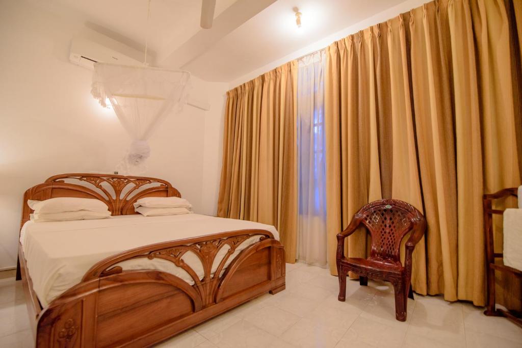 Postel nebo postele na pokoji v ubytování Muhsin Villa - Galle Fort