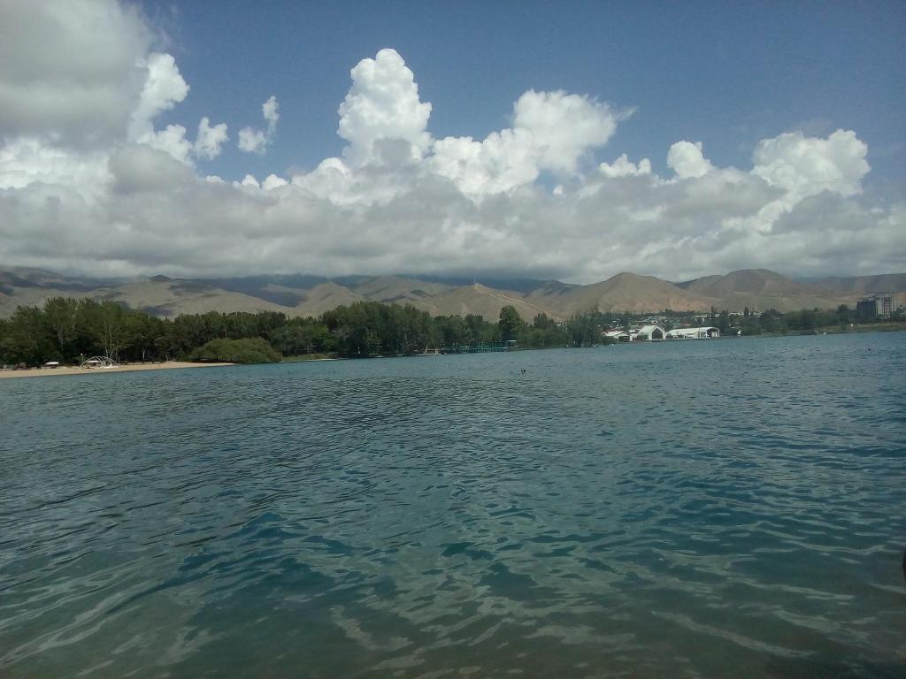 a large body of water with mountains in the background at Resort 10 in Cholpon-Ata
