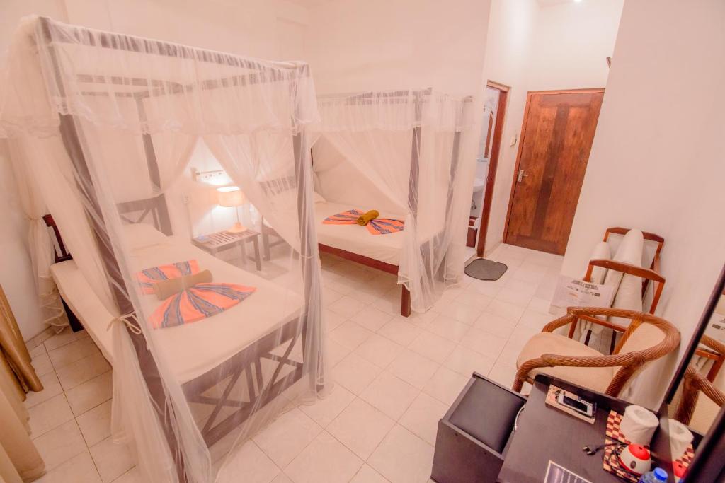 Postel nebo postele na pokoji v ubytování Muhsin Villa - Galle Fort