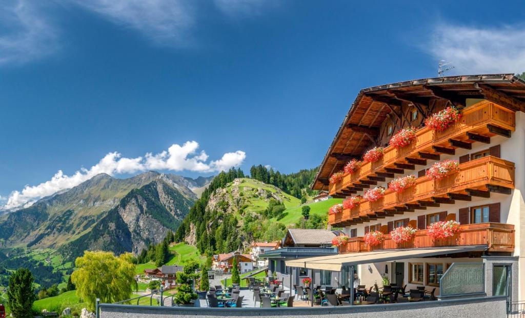 a hotel with a view of a mountain at Hotel Kronhof in Moso