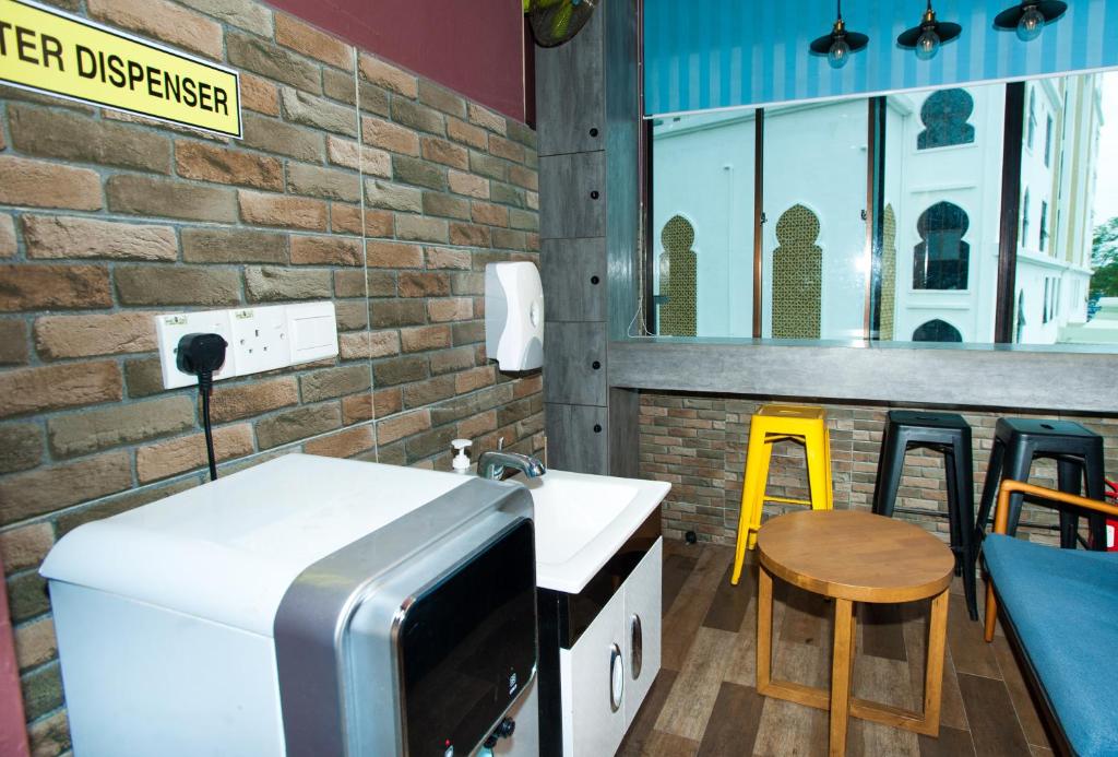 Postel nebo postele na pokoji v ubytování DJ Citi Inn Premier