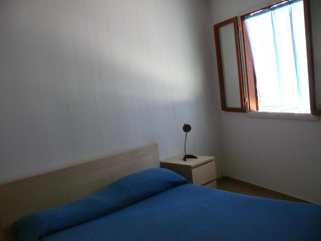 Łóżko lub łóżka w pokoju w obiekcie Residence Il Fortino