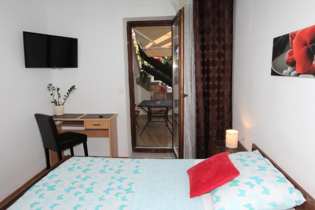 Televízia a/alebo spoločenská miestnosť v ubytovaní Apartment Albert