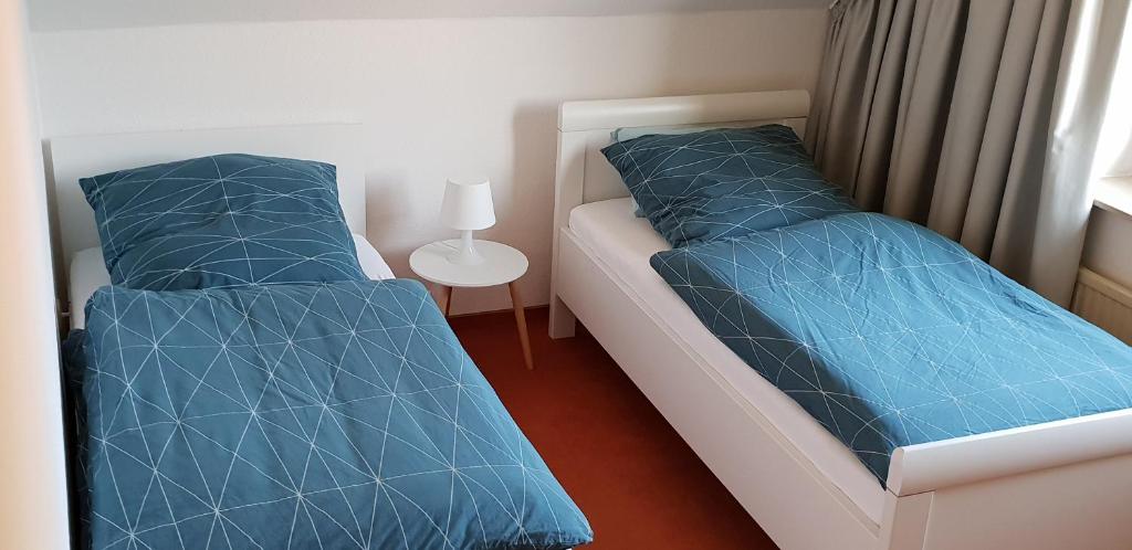 Postel nebo postele na pokoji v ubytování FeWo-Veronika-Apen