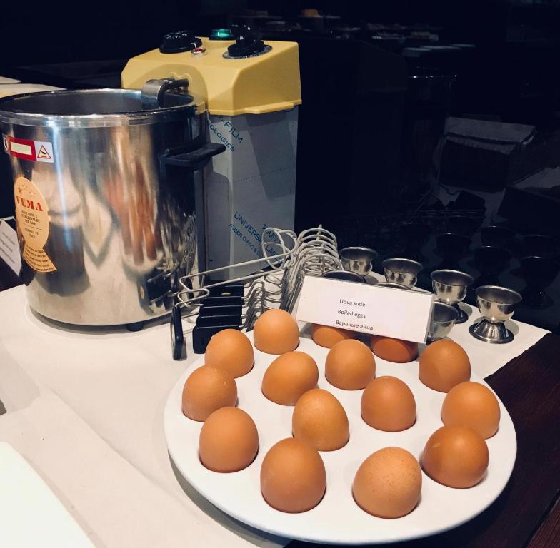 a plate of brown eggs on a counter at Hotel Principe di Piemonte in Rimini