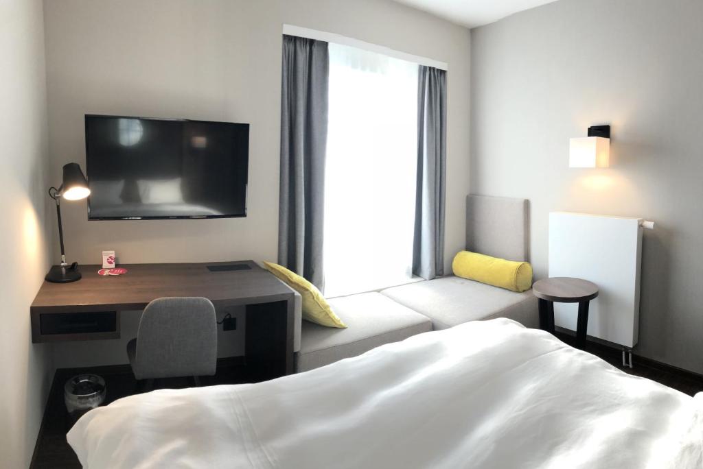 Postel nebo postele na pokoji v ubytování Hotel Smartino