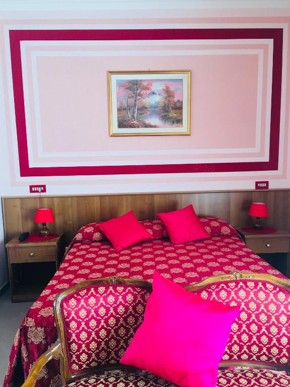Postel nebo postele na pokoji v ubytování Hotel Facioni