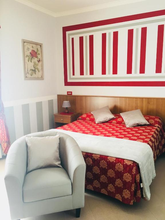 Postel nebo postele na pokoji v ubytování Hotel Facioni
