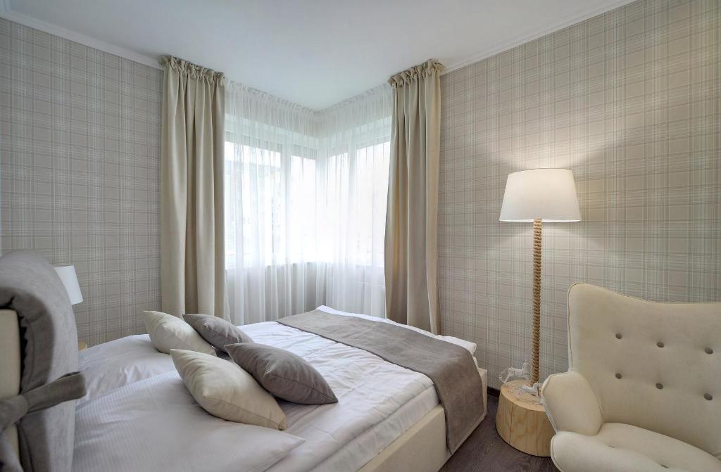 Postel nebo postele na pokoji v ubytování Stonowane i Eleganckie Apartamenty Sun Seasons 24 w Świeradowie Zdroju by Noclegi Renters