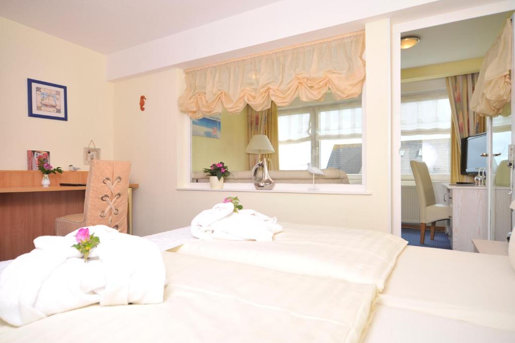 Postel nebo postele na pokoji v ubytování Hotel Hansa