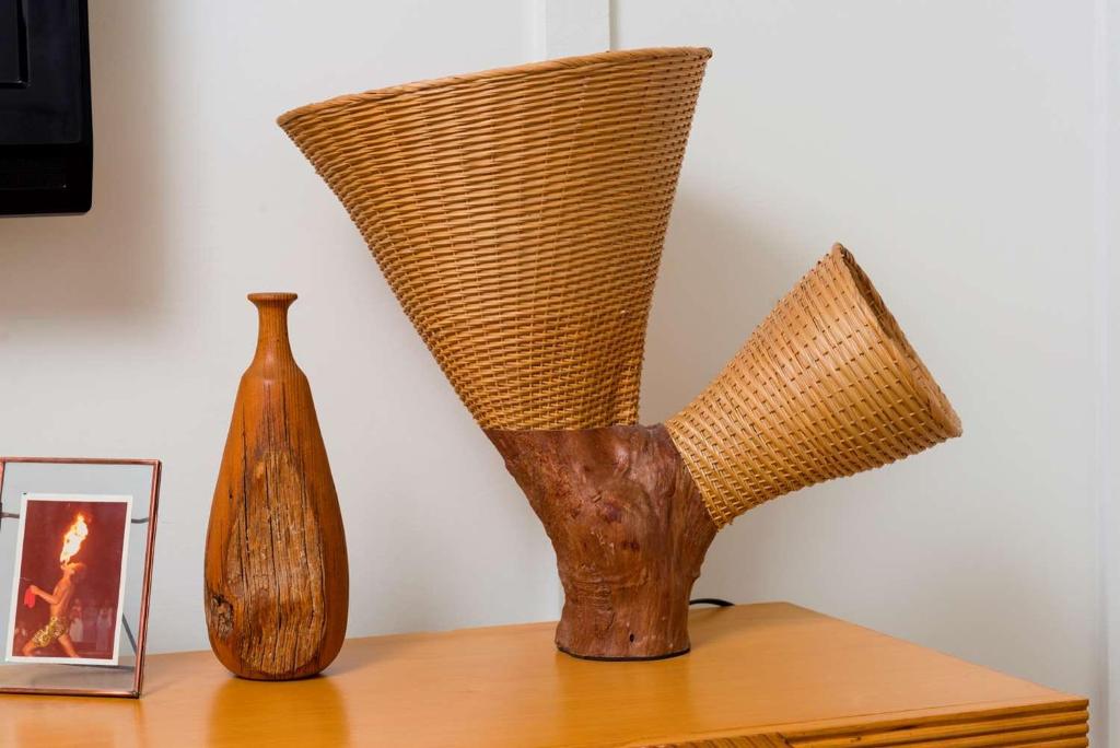 two vases sitting on a table next to a picture at The Surfjack Hotel & Swim Club in Honolulu