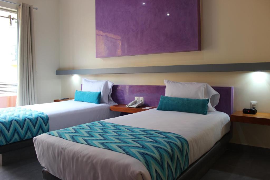Postel nebo postele na pokoji v ubytování Orizaba Inn