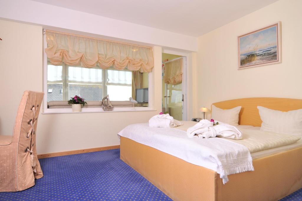 Postel nebo postele na pokoji v ubytování Hotel Hansa