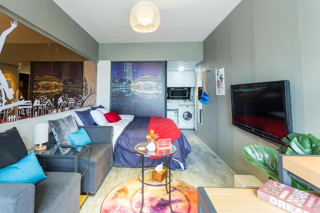 a living room with a bed and a couch at ChengDu WuHou·Jiuyan Bridge· Locals Apartment 00128280 in Chengdu