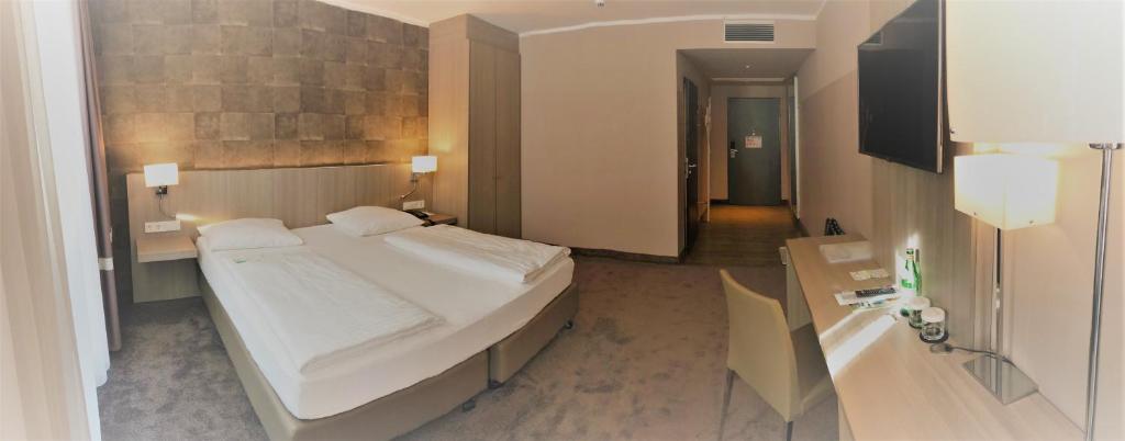 Postel nebo postele na pokoji v ubytování relexa hotel München