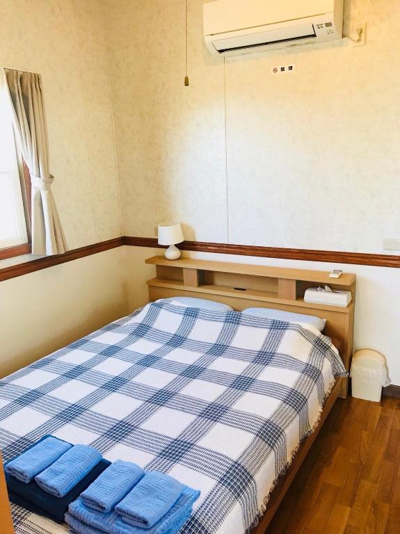 Postel nebo postele na pokoji v ubytování Mini Chula Inn