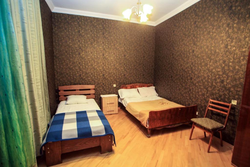 Postel nebo postele na pokoji v ubytování Guest House In Tbilisi
