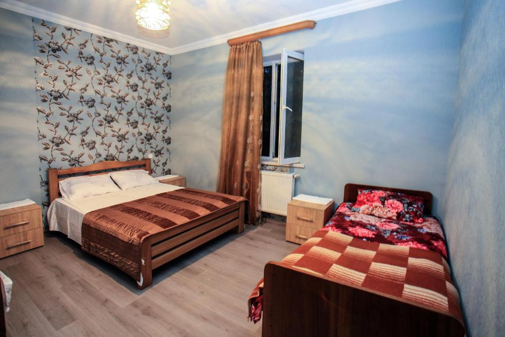 Postel nebo postele na pokoji v ubytování Guest House In Tbilisi