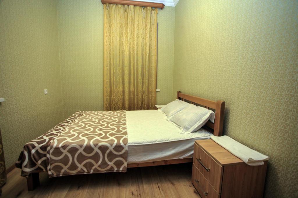 Postel nebo postele na pokoji v ubytování Guest House In Tbilisi