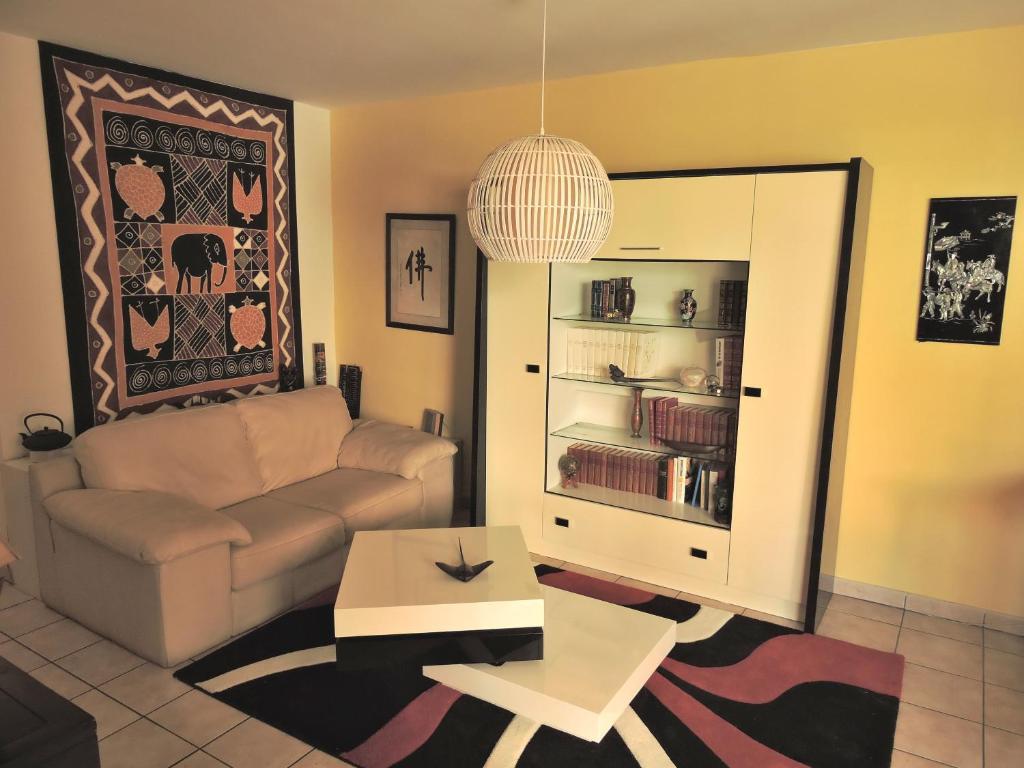 a living room with a couch and a coffee table at Central Montgaillard in Saint-Denis