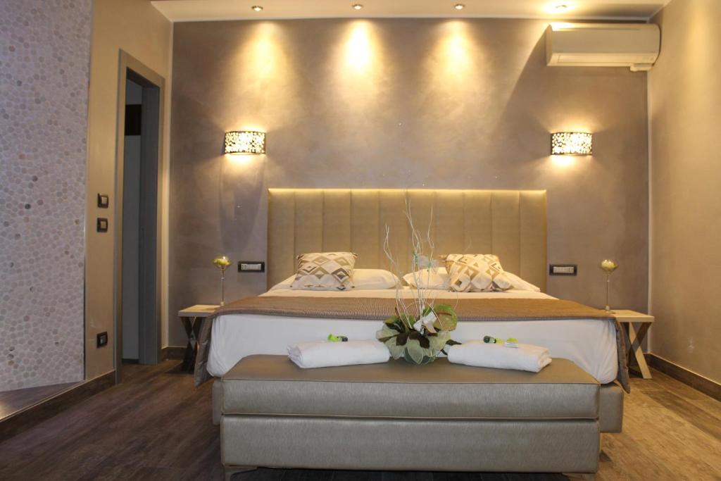 Łóżko lub łóżka w pokoju w obiekcie Hotel Aquila