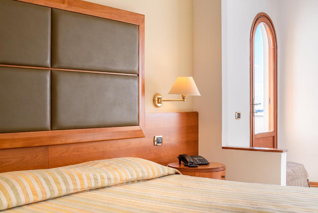 Postel nebo postele na pokoji v ubytování Grand Hotel Don Juan